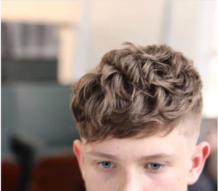 Wavy Textured Layers Mid Fade Boy Haircut