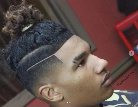 Top Knot with High Fade Black Boy Haircut