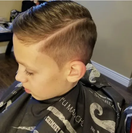 Side Swept Hairstyle With Hard Part And Side Fade