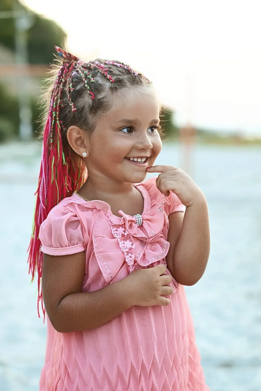 little girl with braided ponytail