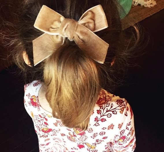 Long Ponytail With A Statement Bow On Top