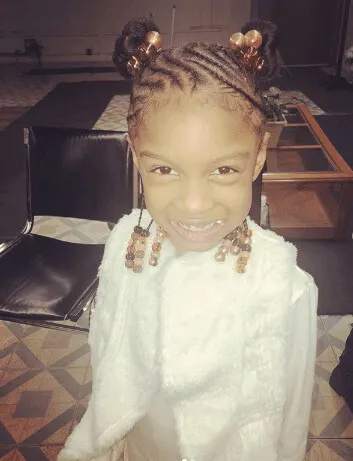 Angled Cornrows With Pigtail Buns