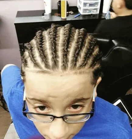 Combed Back Hairstyle With Cornrows And Bun