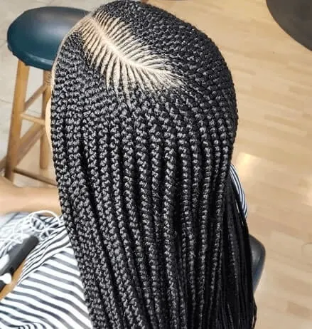 Combed Back Hairstyle With Cornrows And Bun