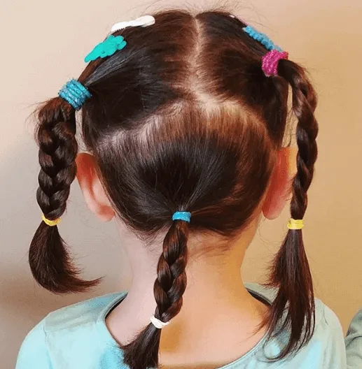 Center Parted Hairstyle With Braided Pigtails And Ponytail