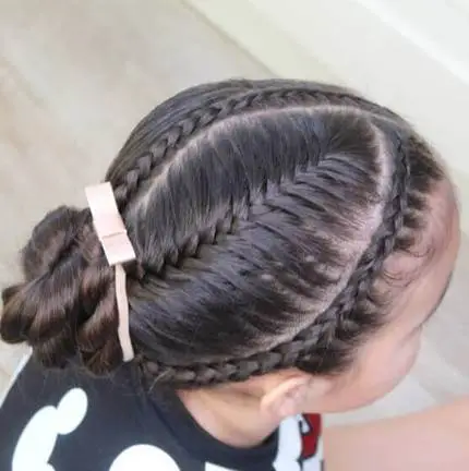 Angled Cornrows With Side Bun And Short Pony