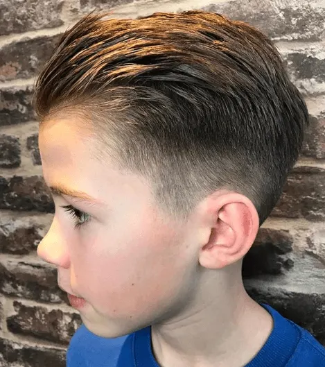 Textured Combed Back Hairstyle With Mid Fade