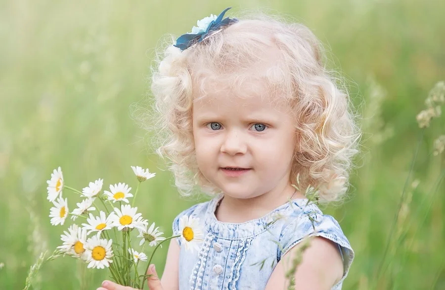 little girl with medium curly blonde bob