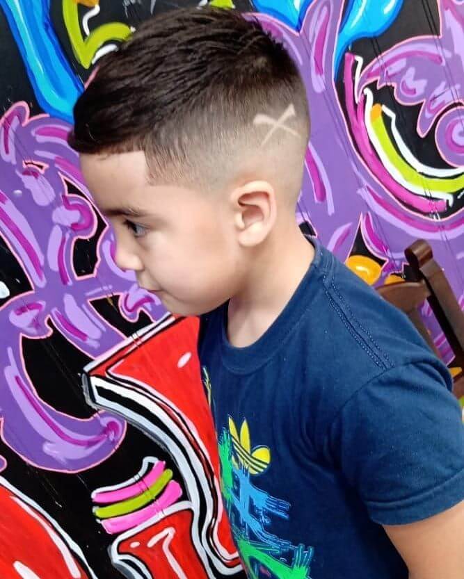 Side Swept Hairstyle With Hard Part And Fade