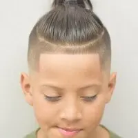 Combed Back Hairstyle With Knot And Side Fade