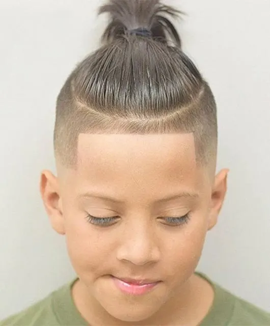 Combed Back Hairstyle With Knot And Side Fade