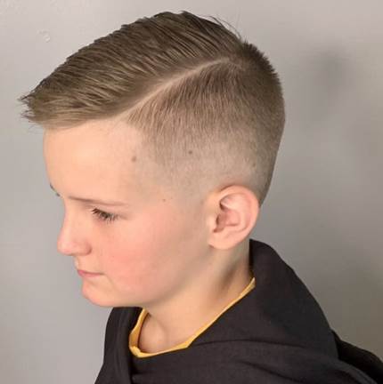 Textured Side Swept Hairstyle With High Fade