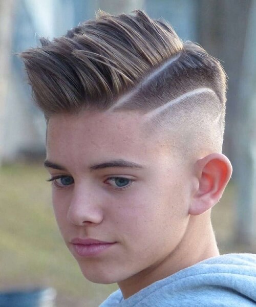 Wavy Brushed Up Hairstyle With Undercut Fade