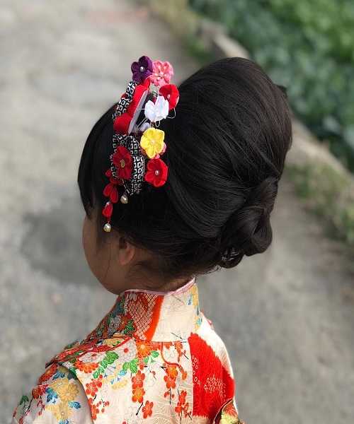 Asian Hairstyle With Typical Hair Bun