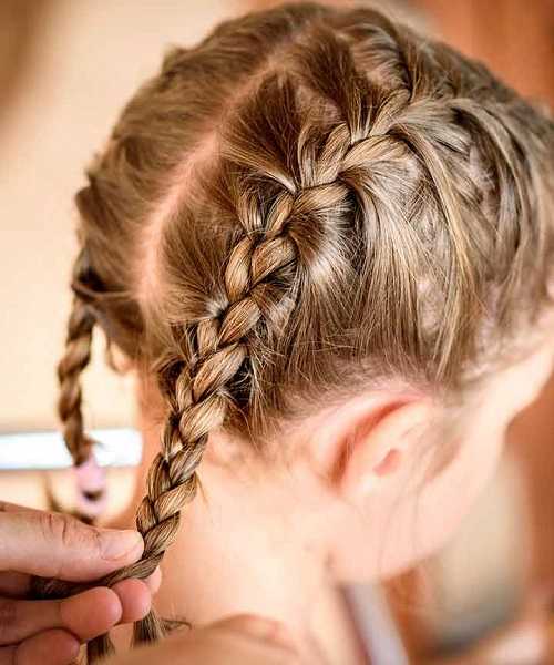 Center Parted Hairstyle With French Braided Tails