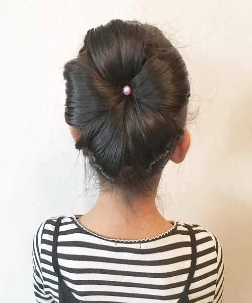 Combed Back Hairstyle With Flower Bun