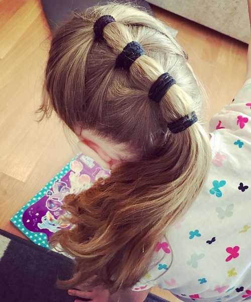 Combed Back Hairstyle With Long Sectioned Ponytail
