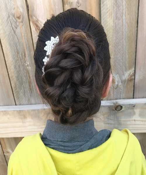 Combed Back Hairstyle With Loose Braided Voluminous Bun