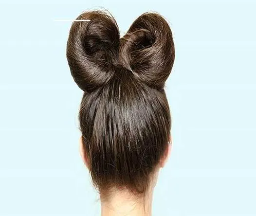 Combed Back Hairstyle With Stylish Hair Bow