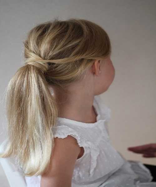 Loosely Textured Combed Back Ponytail Hairstyle