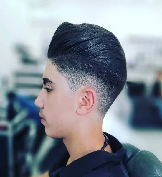 Slicked Back Hairstyle With Mid Fade
