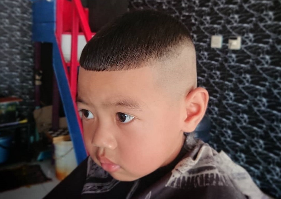 little boy with french crop hairstyle