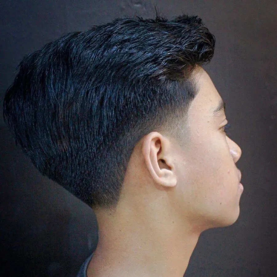 Brushed Up Hairstyle With Layered Taper