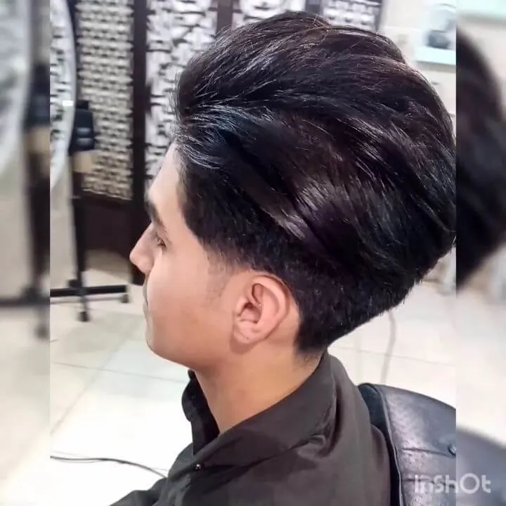 Layered Pushed Back Hair With A Temple Fade