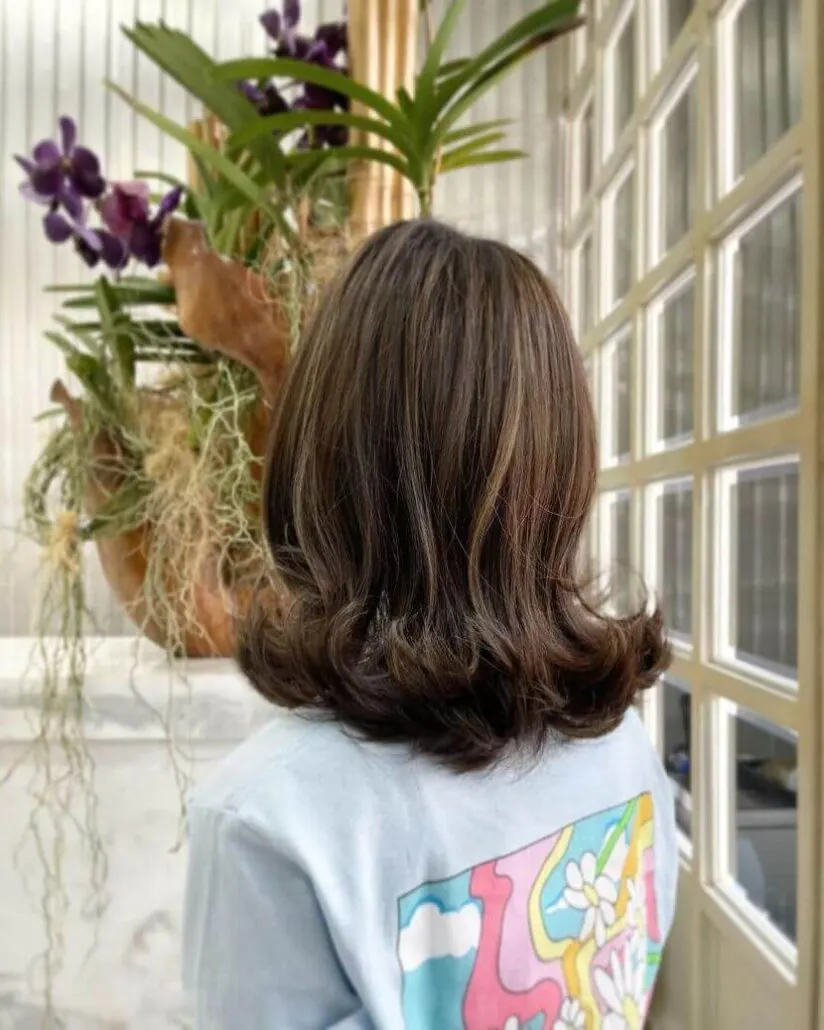 Shoulder-Length Hair With Outward Curls