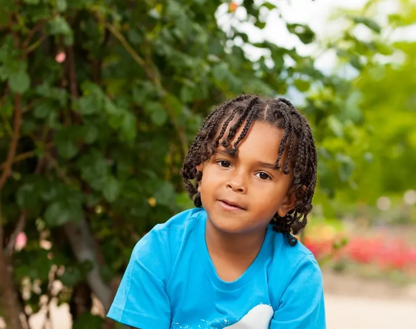 boy with medium length braids