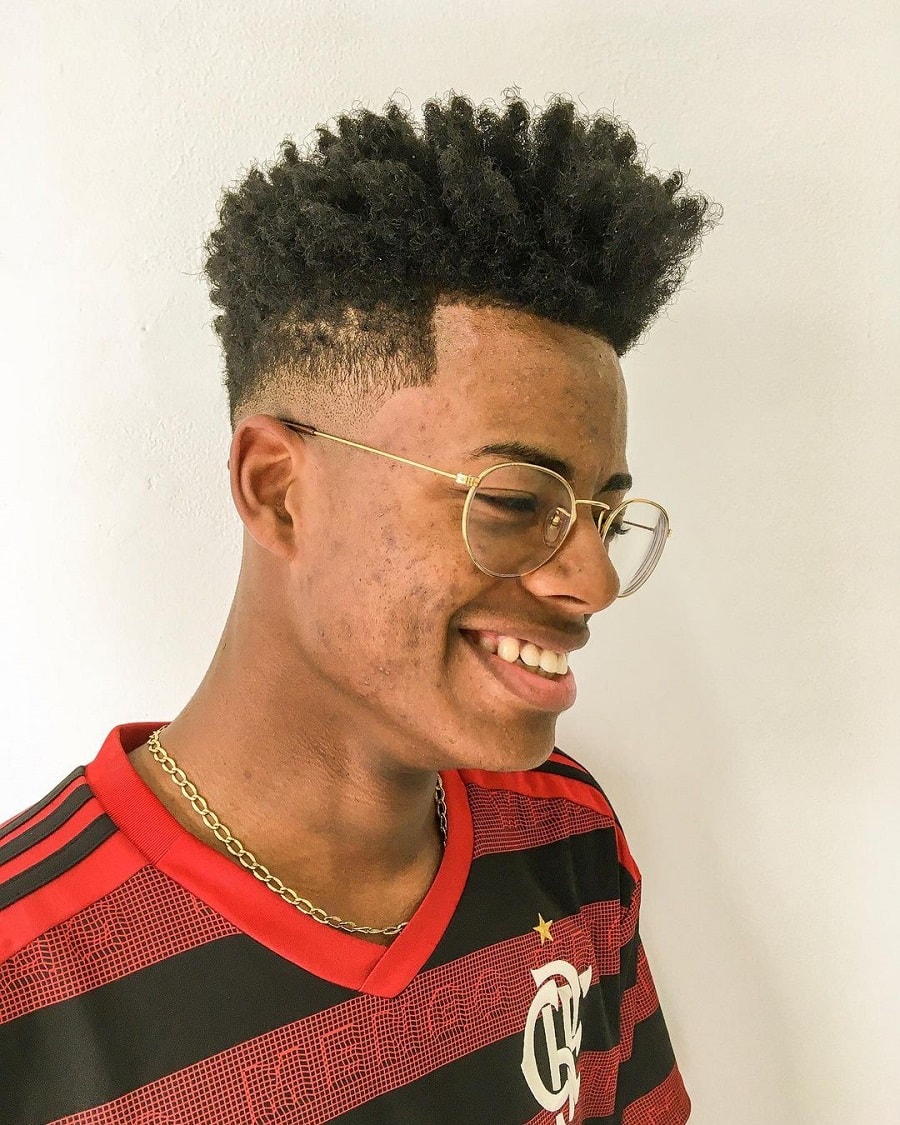 black guy with curly undercut style